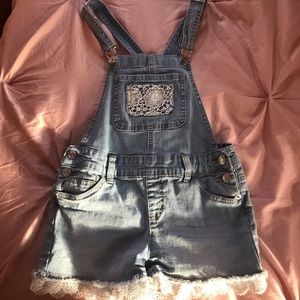 Light blue,cream floral outlining overalls.